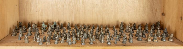 A shelf of Burmese bronze weights