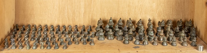 A shelf of Burmese bronze weights