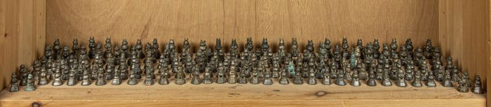 A shelf of Burmese bronze weights