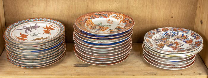 A shelf of Chinese and Japanese porcelain dishes