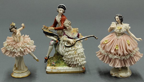 German porcelain crinoline figures: (lot of 3) German porcelain crinoline figures, one depicting a courting couple, each playing a stringed instrument and rising on a naturalistic plinth, 5.5"h, and two depicting ballerinas, each dresse