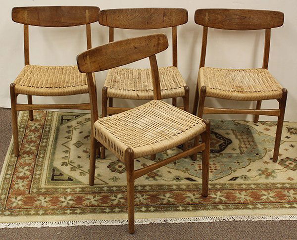 (lot of 4) Danish modern rush seat side chairs: (lot of 4) Danish modern rush seat side chairs, in the style of the Hans Wegner CH23 chair having walnut frames, laminated backs, and Danish cord woven seats. 30.5"h. x 18"w. 16"d.