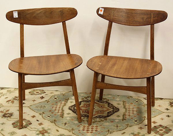 Pair Hans Wegner chairs, for Carl Hansen: Pair of Hans Wegner Chairs, for Carl Hansen circa 1950. Made in Denmark of Oak with oiled finish. Branded mark to bottom of seat. 30''h. x 20''w. x 18''d.