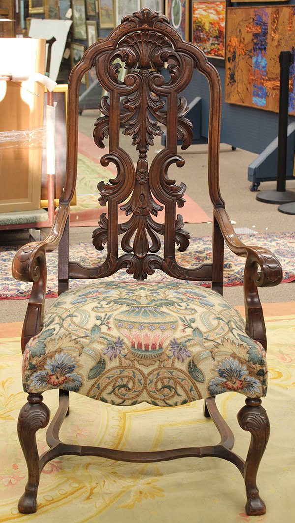 Late Victorian throne chair with ottoman: (lot of 2) Late Victorian walnut throne chair and ottoman, circa 1890, the chair with intricatly carved foliate pierce carved splat centering the scrolled and carved arms rising on stylized cabriole l