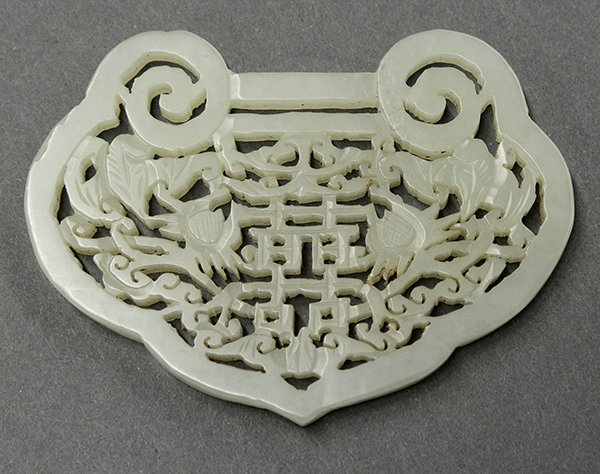 Chinese Pierced Jade Lock: Chinese reticulated jade ruyi lock, pierced with the shuangxi (double happiness) emblem accented with cloud scrolls and bats, 3.25" w