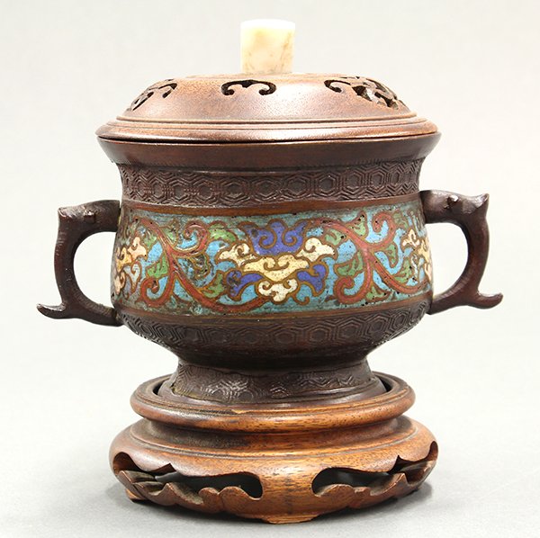 Japanese Covered Champleve Censer: Japanese champleve copper alloy censer, with a pair of zoomorphic handles flanking the body centered with enameled lotus scrolls, in contrast with a cast tortoise shell pattern, with wooden lid and st