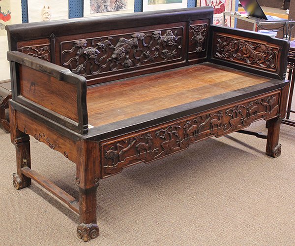 Chinese Carved Wooden Settee/Day Bed: Chinese hardwood settee/day bed, the back carved with three adult lions along with six cubs playing with brocade balls, further flanked by two vases of flowers, the arms further set with panels repeat