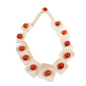 A strand of Naga chank shell and carnelian beads