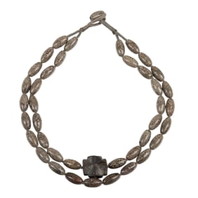 A double-strand fossilized dinosaur bone bead necklace