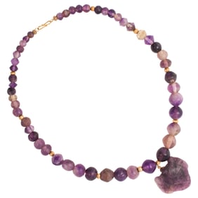 An ancient Egyptian amethyst bead necklace and an amulet pendant