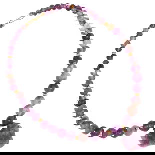 An ancient Egyptian amethyst bead necklace and an amulet pendant: An ancient Egyptian amethyst bead necklace and an amulet pendant. Comprising 51 beads and an animal for amulet, 19" long approximately and 1.5" wide of the pendant.