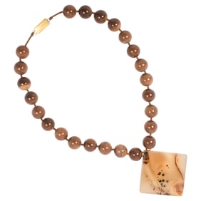 A Chinese brown stone bead necklace with square agate pendant