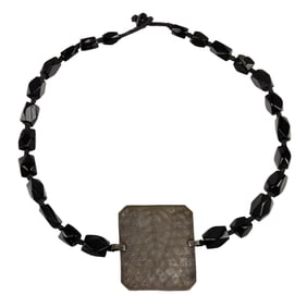 A strand of ancient Roman jet beads with Persian silver pendant