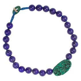 A Chinese lapis lazuli bead necklace carved green stone pendant