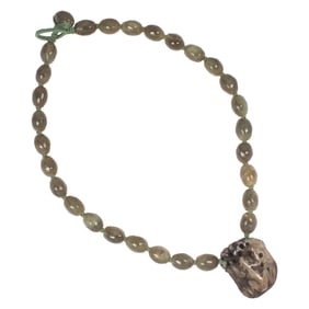 A Chinese green stone bead necklace with jade pendant