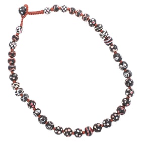 A Venetian black glass bead necklace