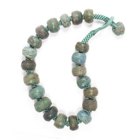 A strand of Hebron turquoise glass beads from Nigeria