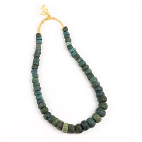 A strand of Hebron turquoise glass beads from Nigeria