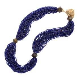 A Naga multi-strand blue glass bead necklace