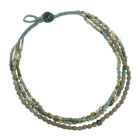 A triple-strand of Pathian faience beads
