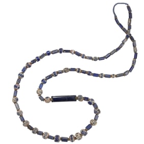 A strand of early Venetian chevron beads and square drawn beads