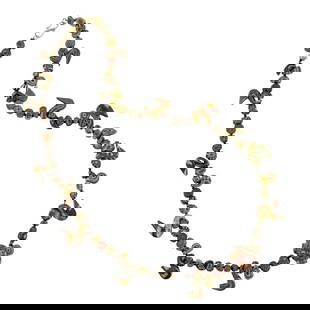 A strand of ancient Byzantine folded mosaic glass beads: A strand of ancient Byzantine folded mosaic glass beads. Strung as a necklace with various forms and sizes of beads, 6 century, 0.875" widest.