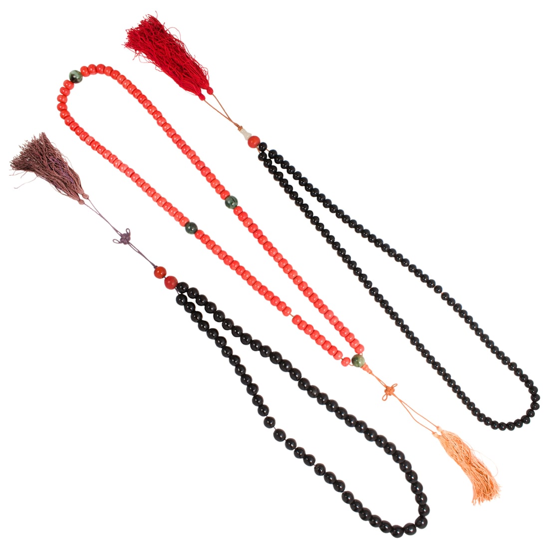 Three strands of Chinese glass prayer beads: Three strands of Chinese glass prayer beads. Comprising strands of black glass beads and a strand of imitation coral glass beads, Qing dynasty, from 26" to 31" long. Provenance: Naomi Lindstrom