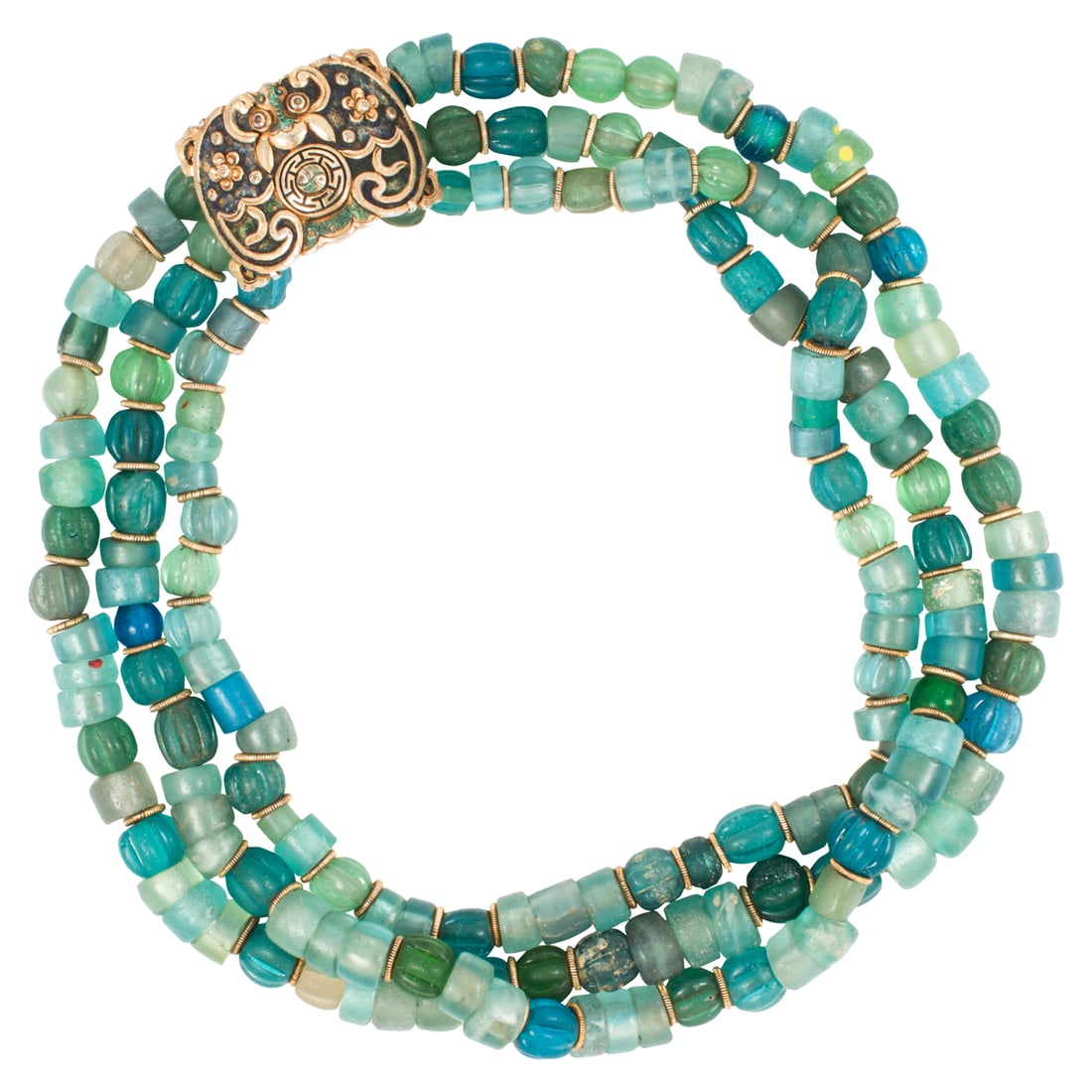 Three strands of Paiwan glass beads: Three strands of Paiwan glass beads. Constructed as a triple-strand necklace with Chinese gilt silver spacers and a gilt silver belt buckle as clasps, 34" long. Provenance: Naomi Lindstrom