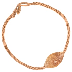An ancient Central Asian banded agate bead