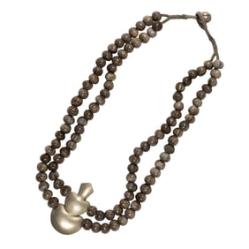 A Job's tears seeds bead necklace with a South American silver pendant