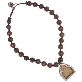 A Tibetan prayer beads strung as necklace with silver tibetan gau box