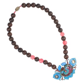 A Chinese bodhi seed, glass necklace and silver pendant