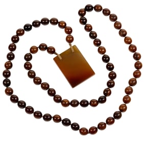 A Chinese horn bead necklace and agate pendant