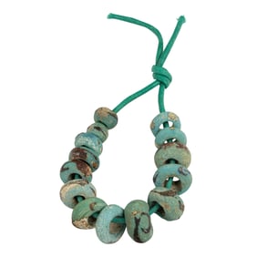 A strand of Han dynasty turquoise glass beads