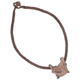 A Chinese bronze mask-form harness ornament