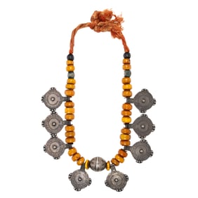 A Berber amber bead and silver necklace