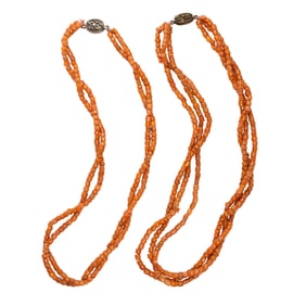 Two Sino-Tibetan red coral multi-strand bead necklaces