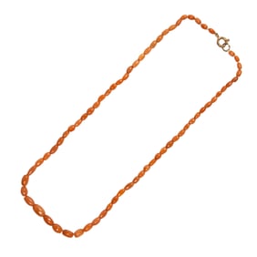 A Chinese child's red coral bead necklace