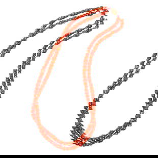 A Tibetan red coral double-strand bead necklace: A Tibetan red coral double-strand bead necklace. 19th century, each bead measuring approximately 0.25" wide, 22" overall length. Provenance: Naomi Lindstrom