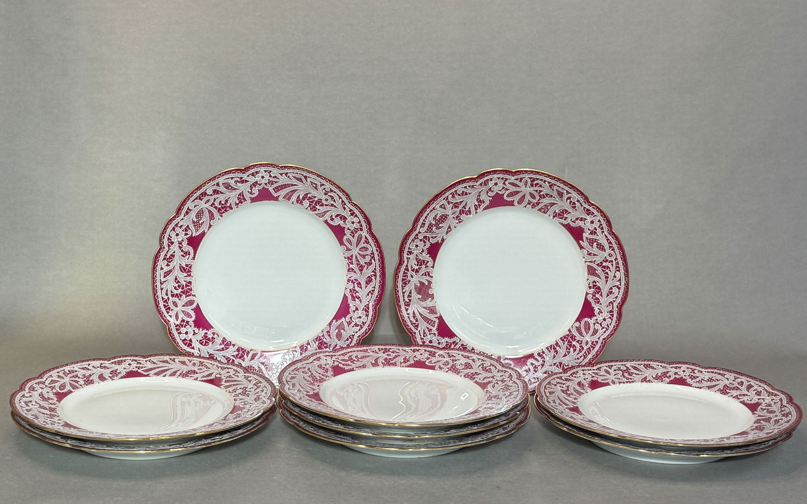 Set of Nine Antique French Porcelain Dishes with Raised Lace Design: (lot of 9) French antique porcelain dishes with raised lace design. Each: 9.5"dia (24.13 cm) NOTE: THIS ITEM IS IN NEW YORK, WHERE IT CAN BE SHIPPED FROM.