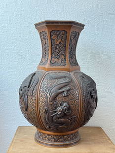Japanese Meiji Bronze Vase with Dragon Phoenix Design: Antique Japanese Meiji period bronze vase with dragon and phoenix motif, detailed in the casting, heavy in weight, bottom bears hall mark. 15"h (38.1 cm) NOTE: THIS ITEM IS IN NEW YORK, WHERE IT CAN B
