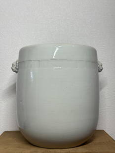 Chinese Blanc de Chine Porcelain Vase with Foolion Head: Chinese antique blanc de chine porcelain vase with foolion mask side. 10"h x 10"dia (25.4 x 25.4 cm) Condition: one kiln fissure flaw at lower side of the vase as seen in photo. NOTE: THIS ITEM IS IN