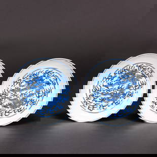 Pair of Chinese Blue and White 'Dragon' Dishes: (lot of 2) Pair of Chinese blue and white 'dragon ' dishes, each of shallow rounded form, interior decorated with a roundel of dragon pursuing a pearl amid flames and the exterior encircled by two
