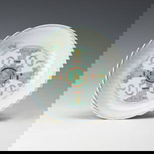 A Doucai Porcelain Dish: Chinese doucai porcelain dish. The shallow dish is decorated on the interior with a double vajra within double circles, and on the exterior with an undulating scroll bearing the bajixiang, Eight