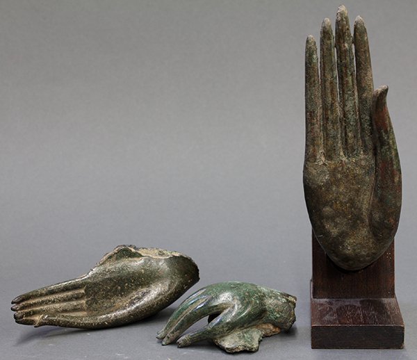 Three Thai Bronze Buddha Hands: (lot of 3) Thai bronze hands of Buddhist figures, each in a different mudra, largest: 5.75"