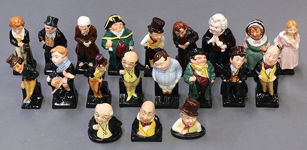Royal Doulton Dickens figures: (lot of 20) Royal Doulton porcelain Charles Dickens character figurines including Fat Boy, Bill Sikes, Scrooge, Tiny Tim, Little Nell, Bumble, Artful Dodger, Fagin, Buzfuz, together with three busts o