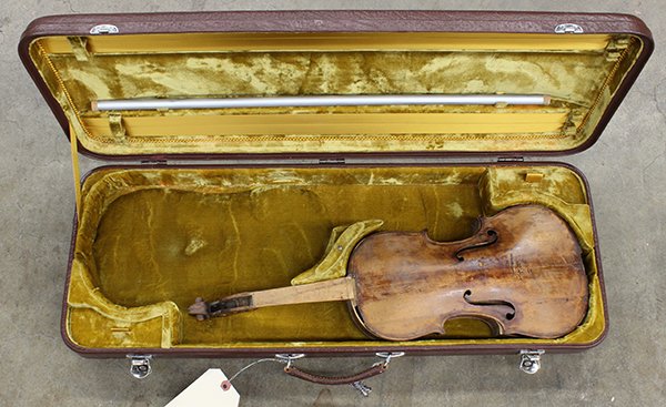 Violin, 19th century, with spurious label for Laurentiu: Violin, 19th century, with spurious label for Laurentius Storioni readng "Fecit cremonae 1773" (damaged), together with an assocated case, overall: 31"l