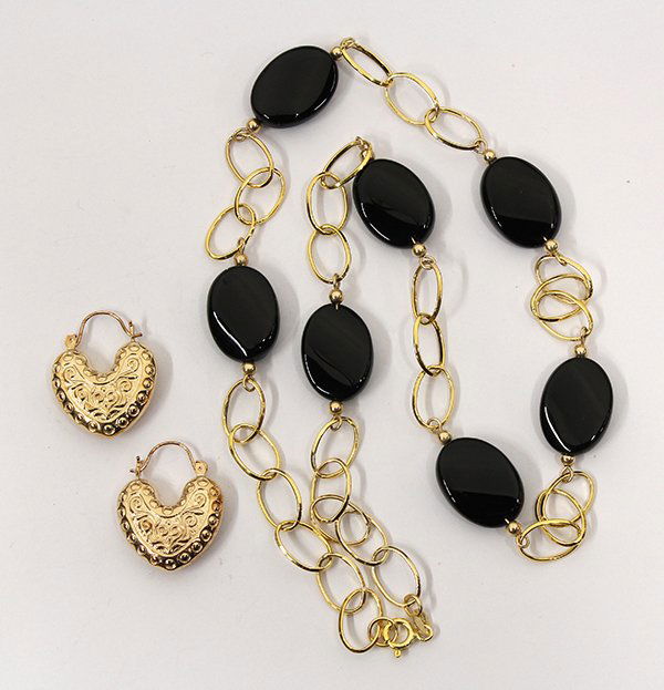 Two fourteen karat yellow gold jewelry items: Two fourteen karat yellow gold jewelry items including a pair of engraved heart shape hoop earrings, 2.9 grams and one black onyx station necklace, 17.8 grams, length 20"