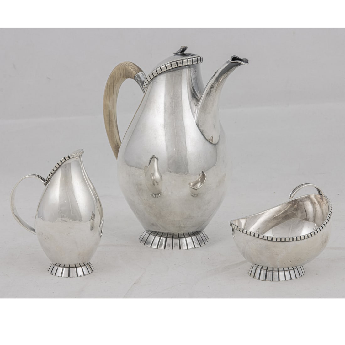 A German Jugendstil Wilhelm Binder sterling three-piece coffee serivce