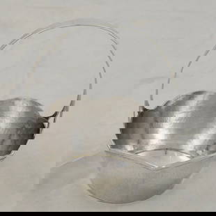 A hammered sterling silver basket: A hammered sterling silver basket, hallmarked, 5.75"h x 4.5"dia. 4.55 troy oz.